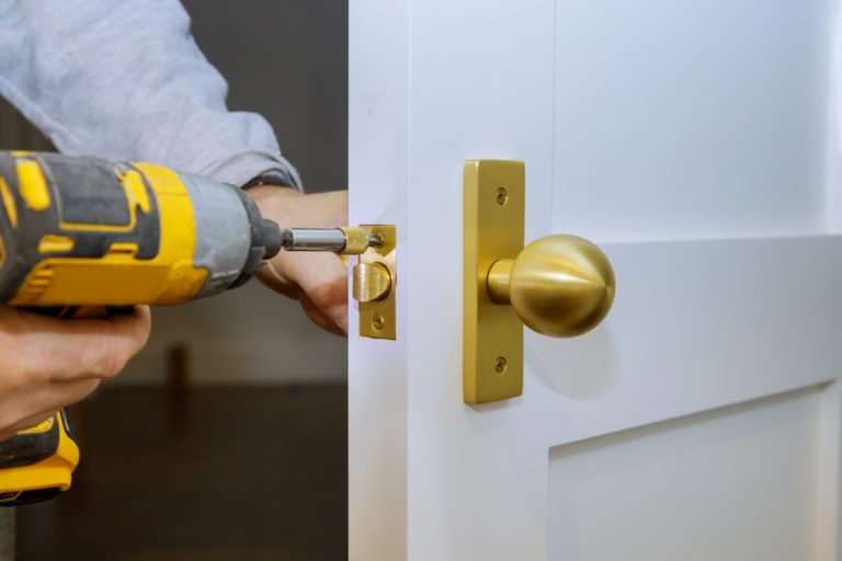 man drilling locks commercial locksmith services in kissimmee, fl – efficient and swift locksmith services for your office and business